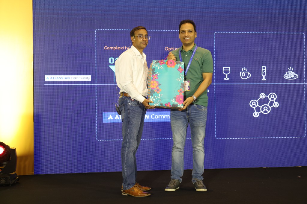 Dushyant Sharma being thanked with a gift on stage at the ACE Pune annual community conference.
