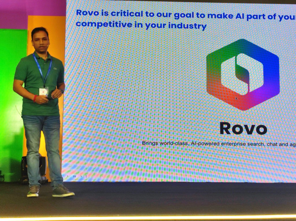Dushyant Sharma on stage at ACE Pune introducing Rovo as the AI layer of the System of Work.