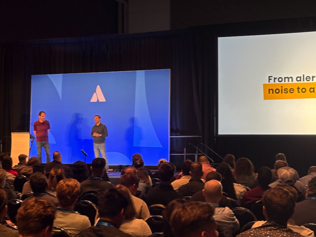 Wide shot of the “From alert noise to action” session at Atlassian Team ’26.